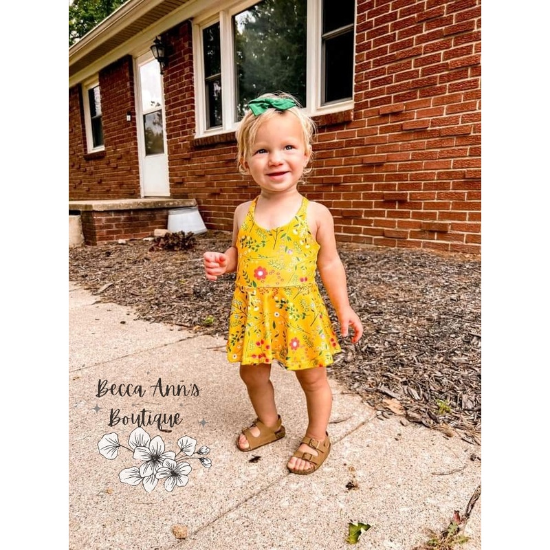 Baby/Toddler Brielle Bodysuit|NB|0-3M|3-6M|6-9M|9-12M|12-18M|18-24M|2T|3T|4T|5T|Straps (Halter tie or Crossback or Shoulder Tie) — Leave details in notes|Short Sleeve|Long Sleeve (Cuff or hemmed) — Leave details in notes|Top Skirt (peplum style)|Knee Le
